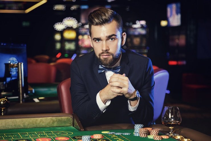 Dealer studio environment showing multiple live blackjack and roulette tables with multilingual dealer teams